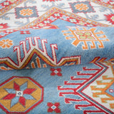 Folded edge and wool pile of blue & red Kazak-inspired wool rug 24986.