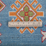 Wool pile close-up of blue & red Kazak-inspired wool rug 24986.