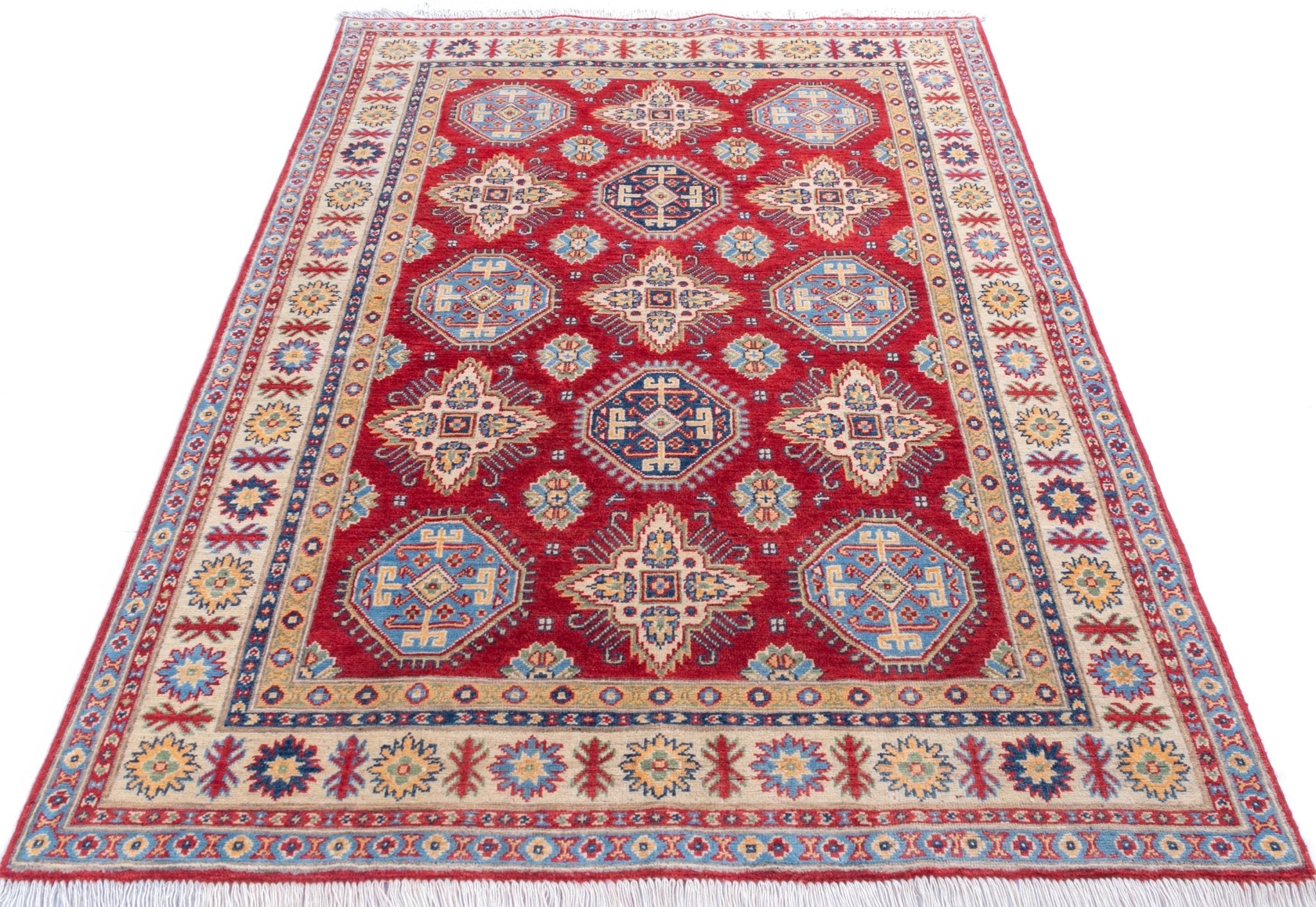 Full view from a low angle of red & blue Kazak-inspired wool rug 21988.
