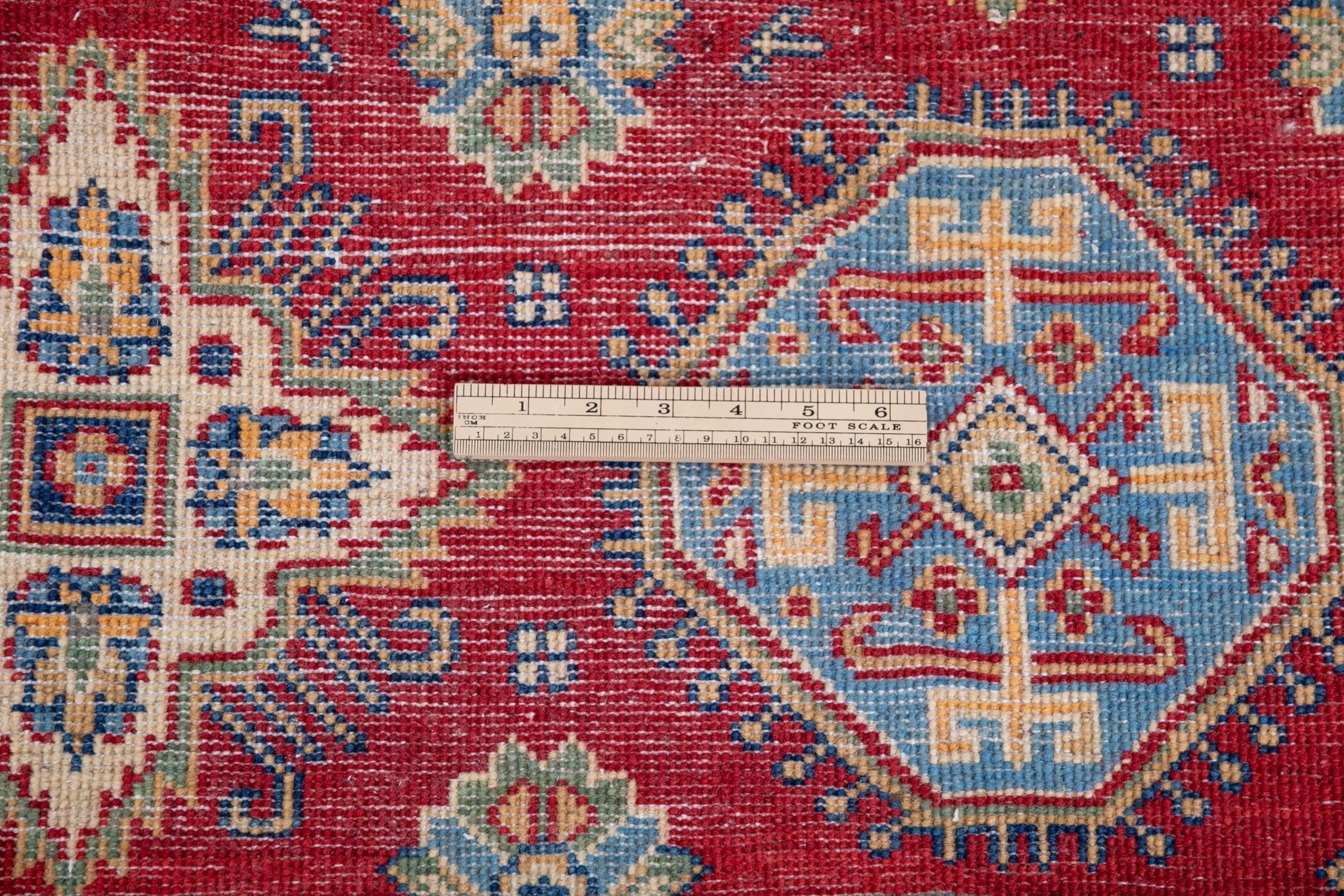 Wool pile close-up of red & blue Kazak-inspired wool rug 21988.