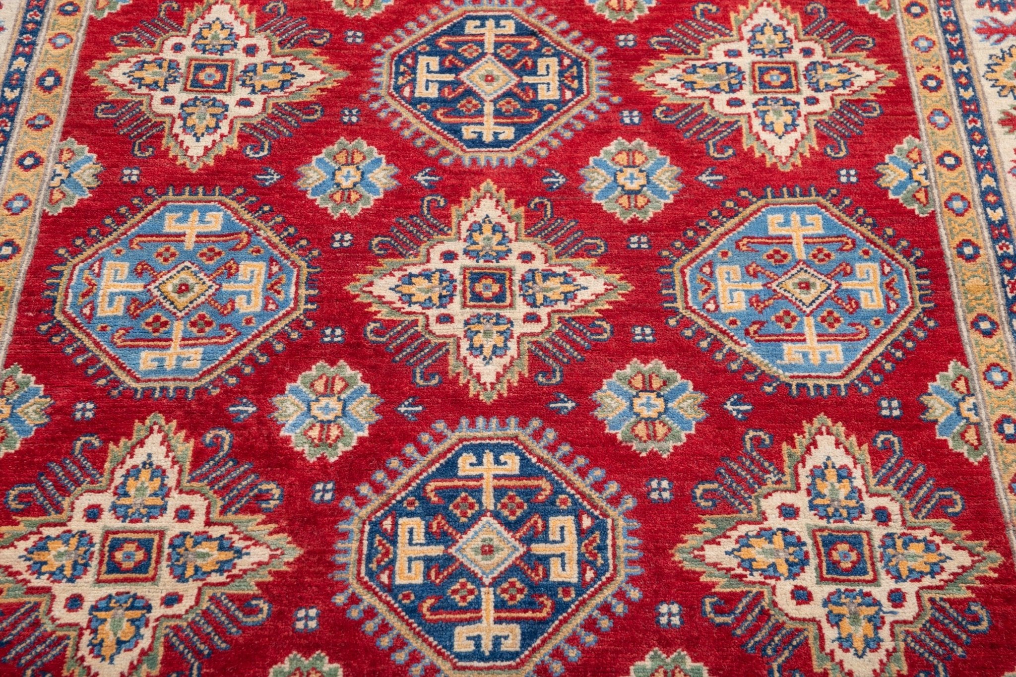 Pattern detail of red & blue Kazak-inspired wool rug 21988.
