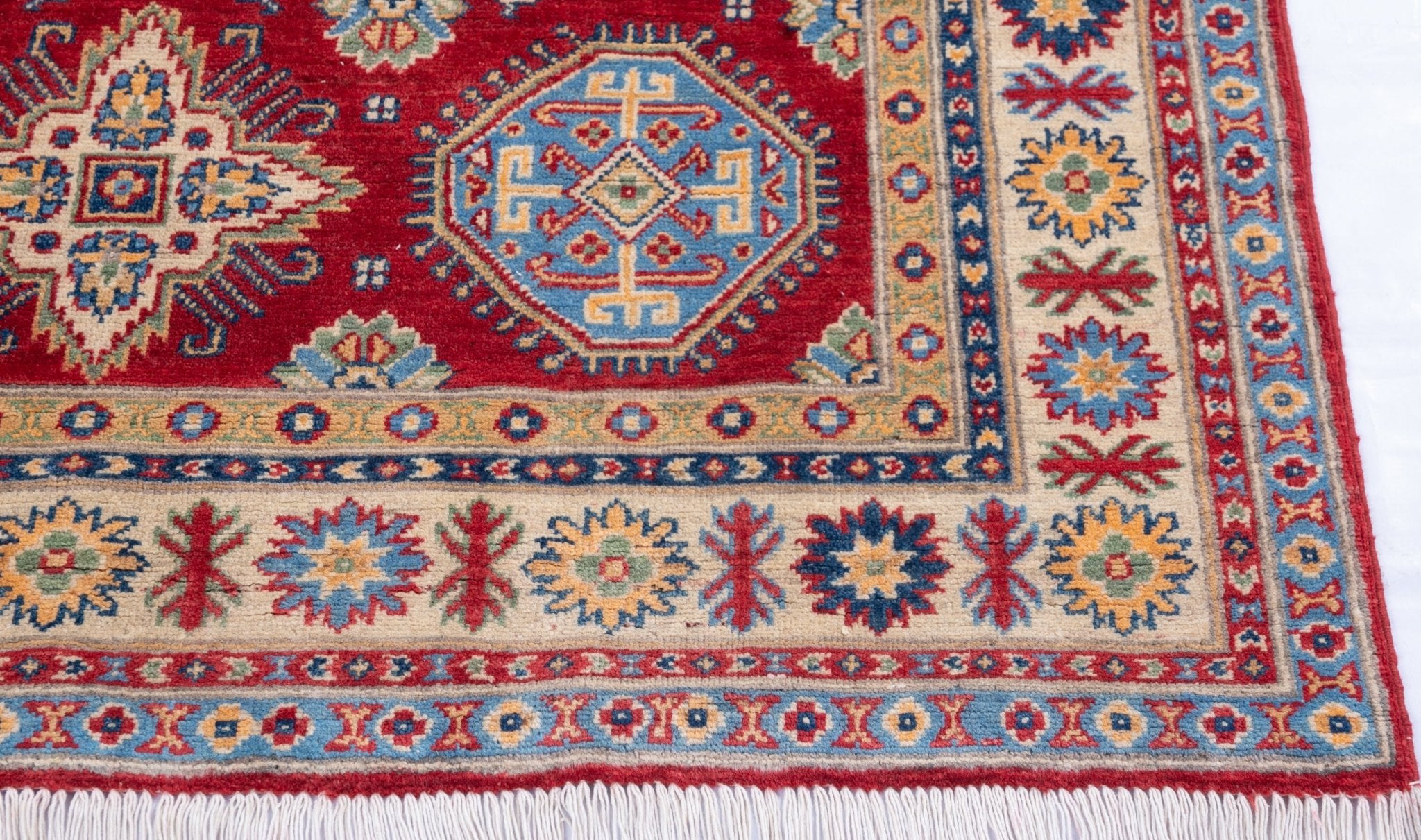 Border and edge detail of red & blue Kazak-inspired wool rug 21988.