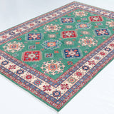 Full view at an angle of green & blue Kazak-inspired wool rug 29639.