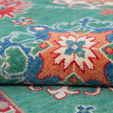 Folded edge and wool pile of green & blue Kazak-inspired wool rug 29639.