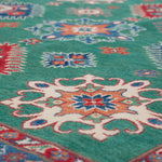 Pattern detail of green & blue Kazak-inspired wool rug 29639.