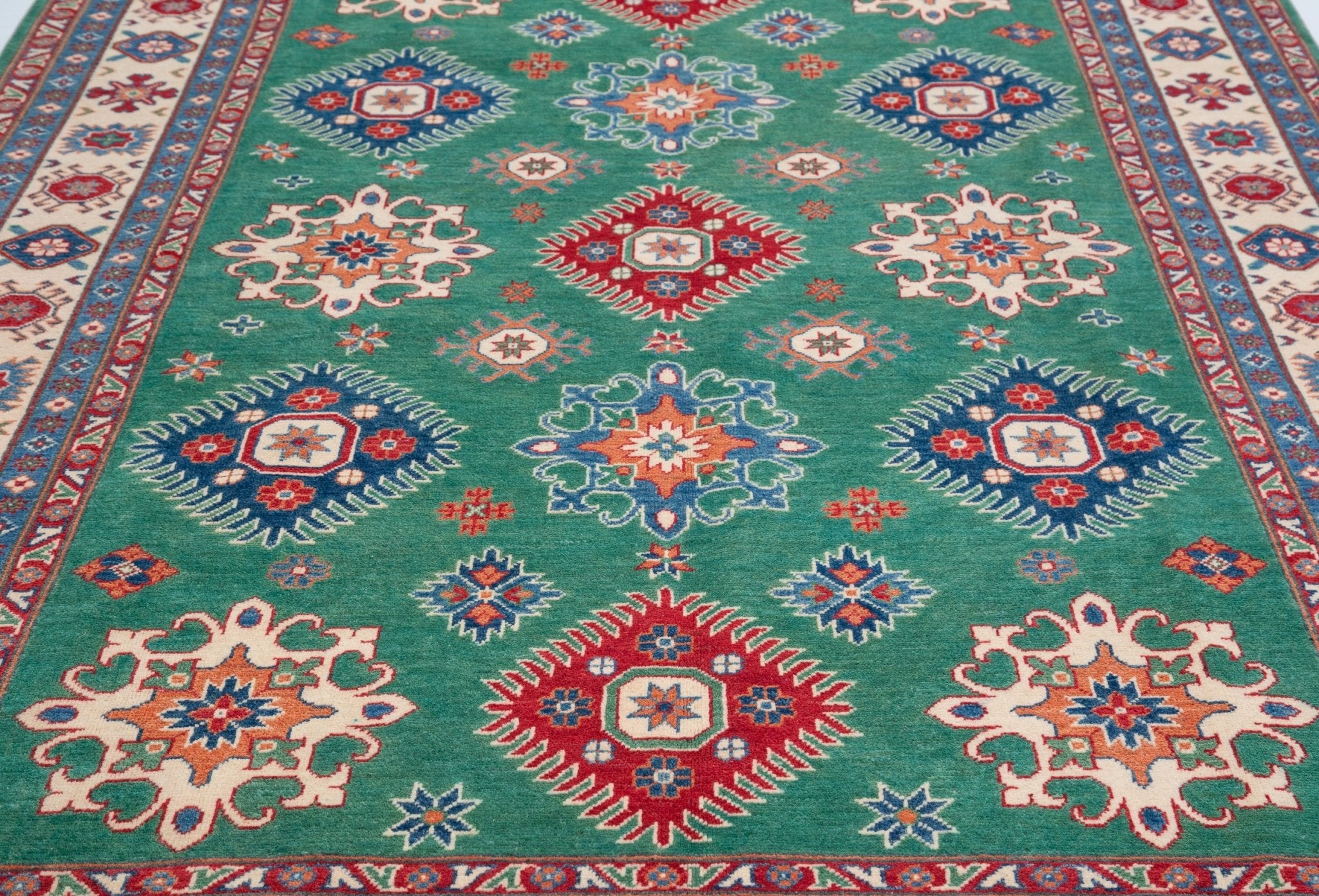 Pattern detail of green & blue Kazak-inspired wool rug 29639.