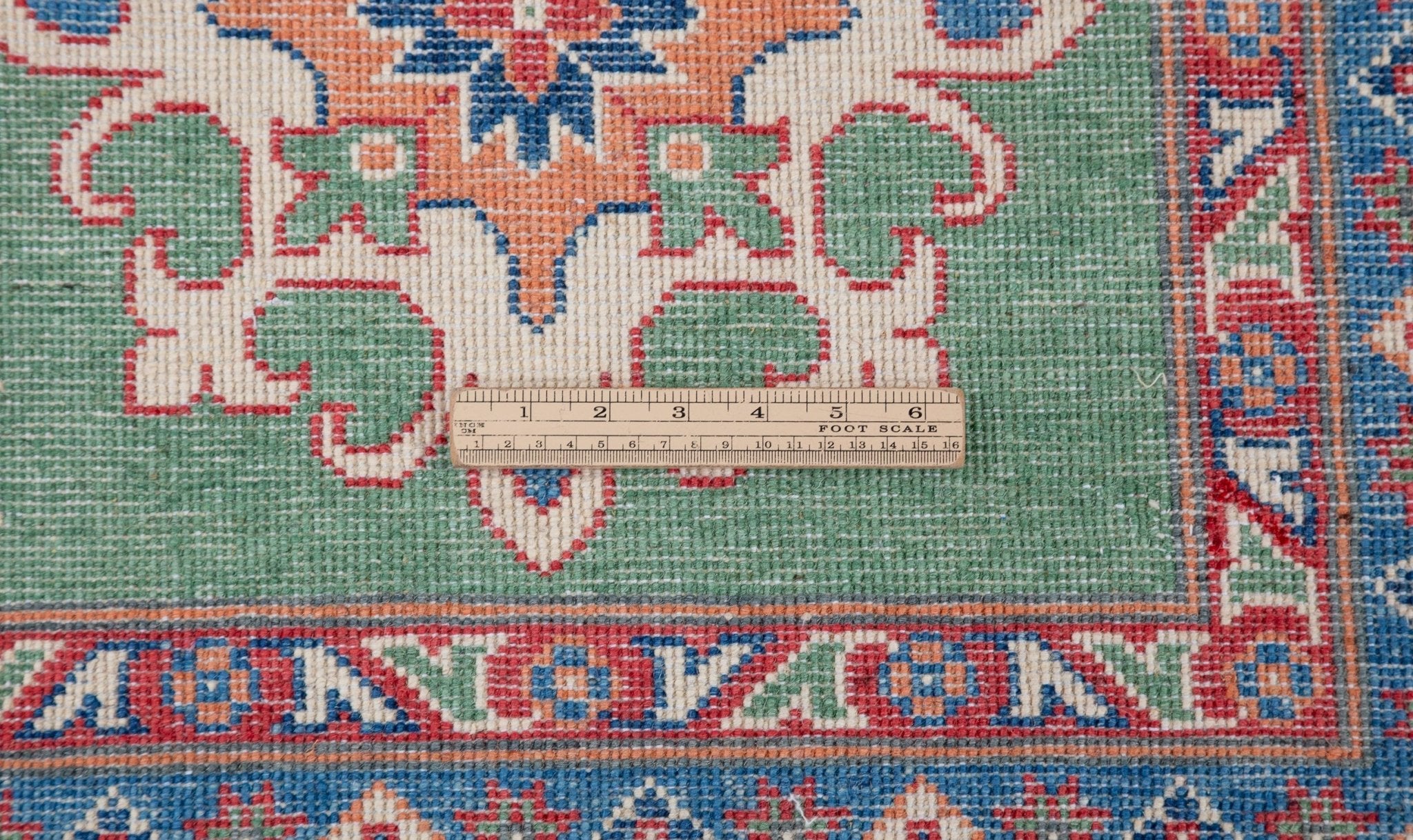 Wool pile close-up of green & blue Kazak-inspired wool rug 29639.
