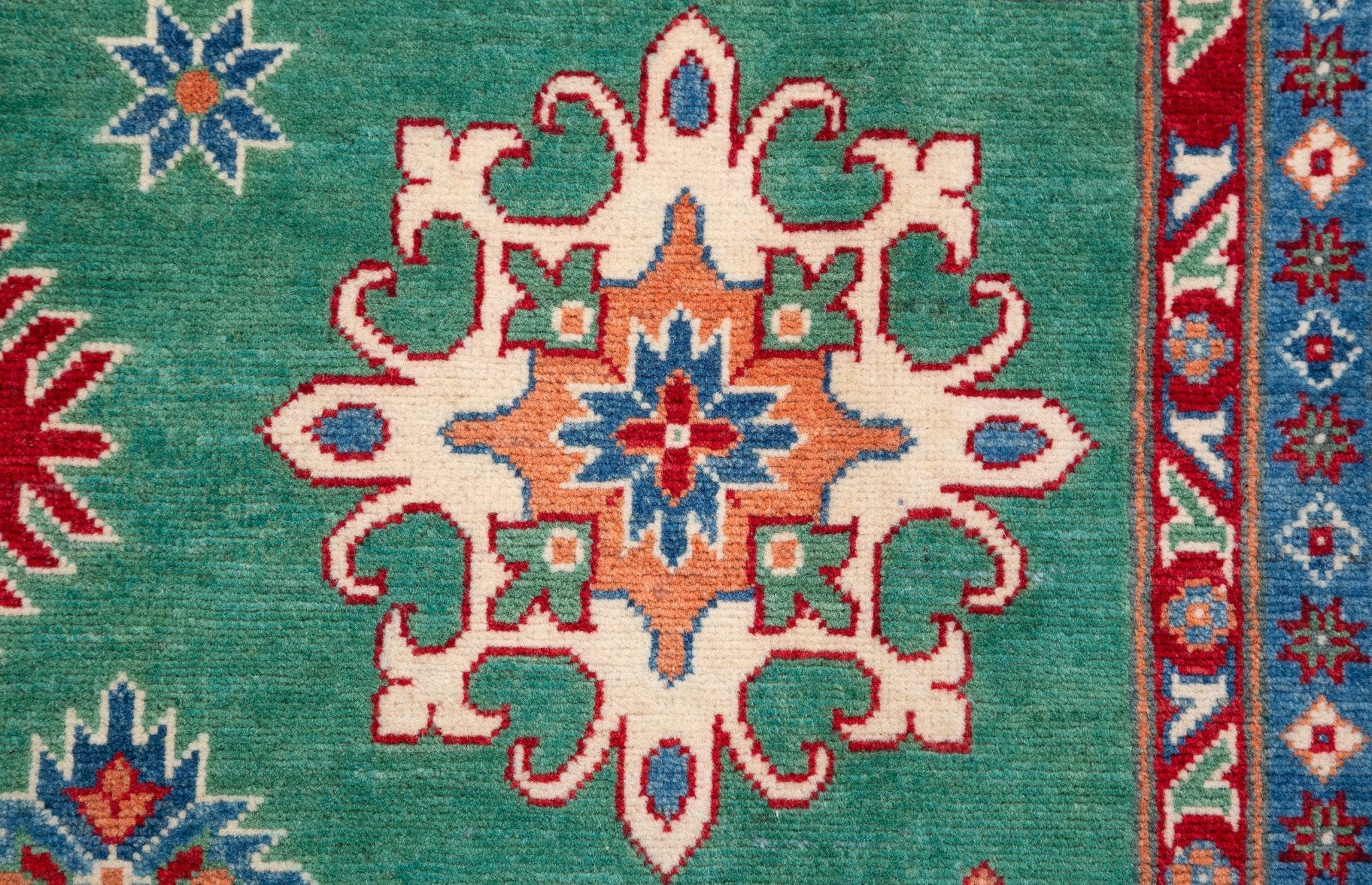 Pattern detail of green & blue Kazak-inspired wool rug 29639.