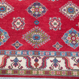 Pattern detail of red & blue Kazak-inspired wool rug 24995.