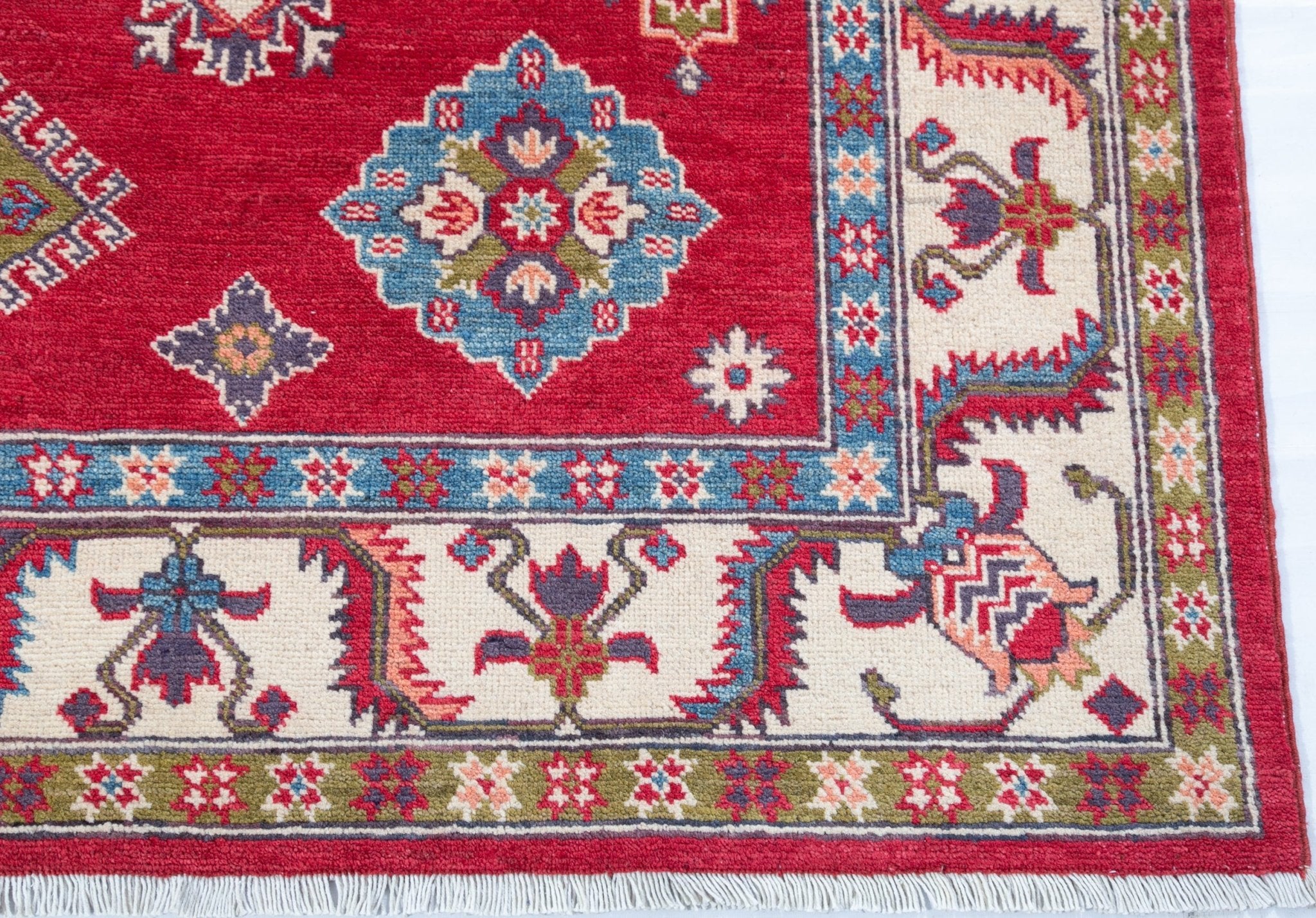 Border and edge detail of red & blue Kazak-inspired wool rug 24995.