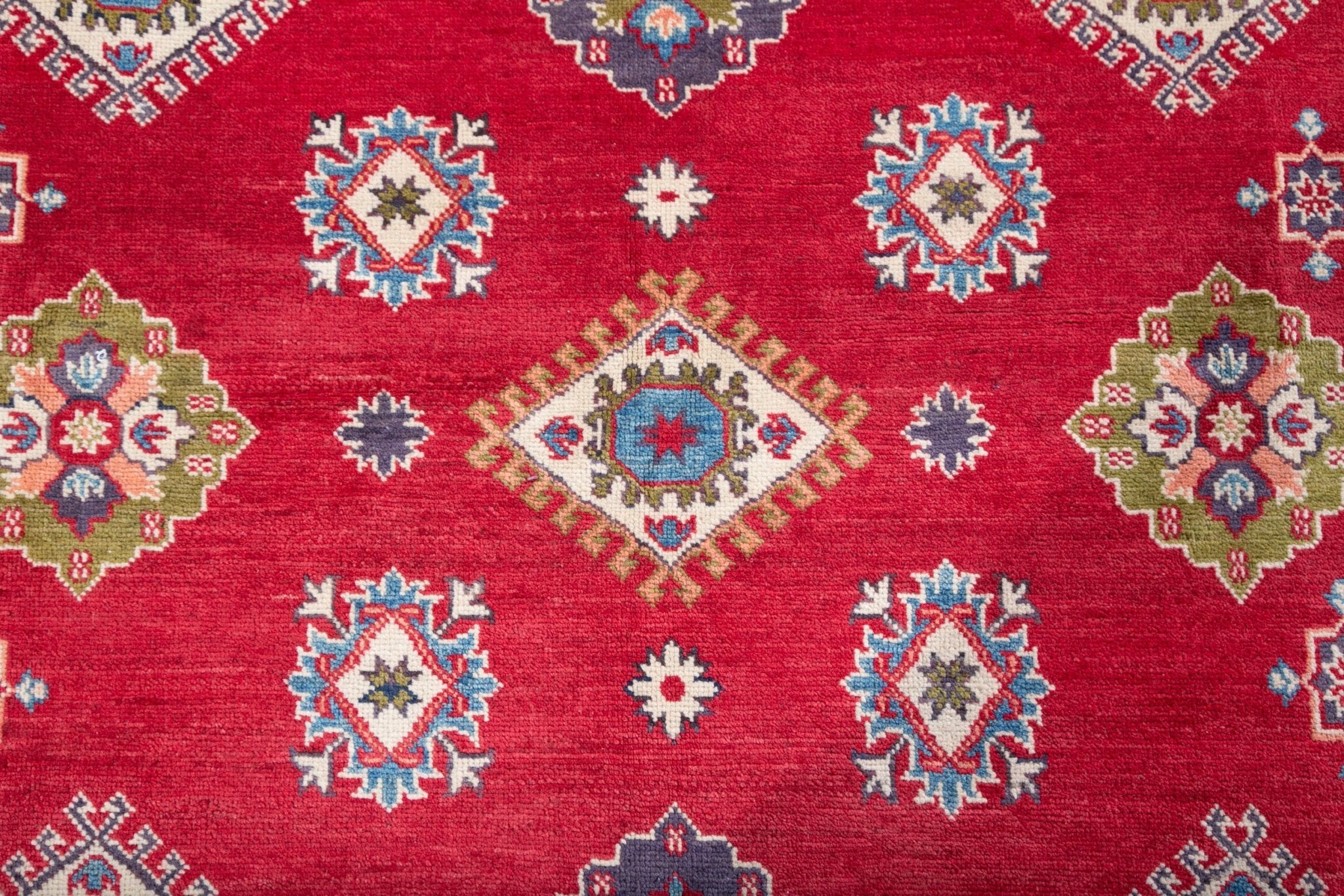 Pattern detail of red & blue Kazak-inspired wool rug 24995.