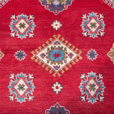 Pattern detail of red & blue Kazak-inspired wool rug 24995.
