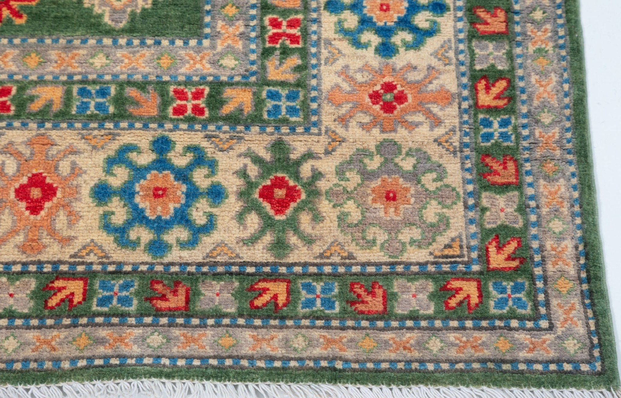 Border and edge detail of green & blue Kazak-inspired wool rug 29637.