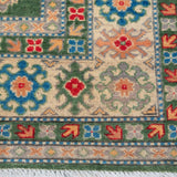 Border and edge detail of green & blue Kazak-inspired wool rug 29637.