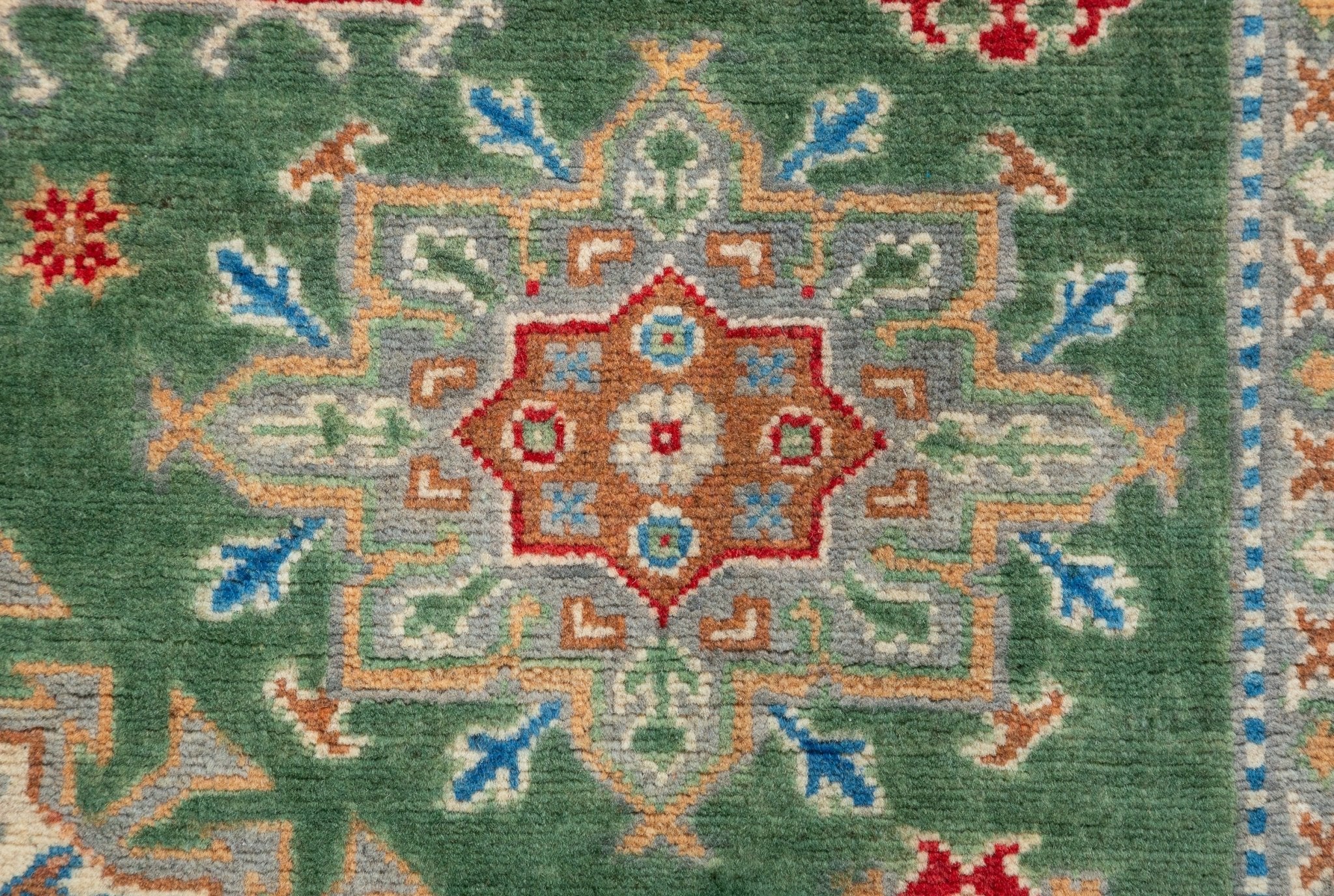 Pattern detail of green & blue Kazak-inspired wool rug 29637.