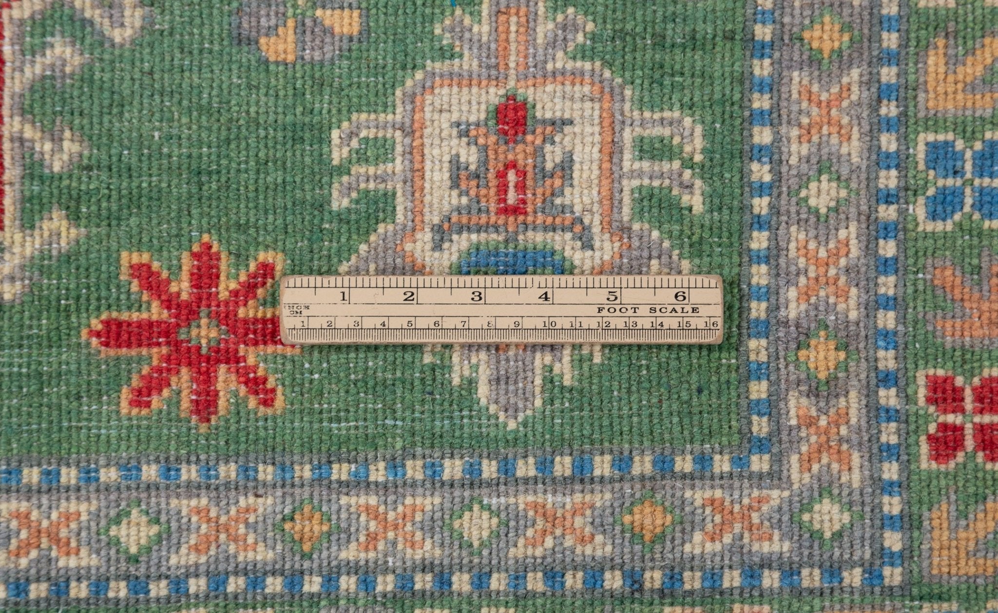 Wool pile close-up of green & blue Kazak-inspired wool rug 29637.