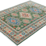 Full view at an angle of green & blue Kazak-inspired wool rug 29637.