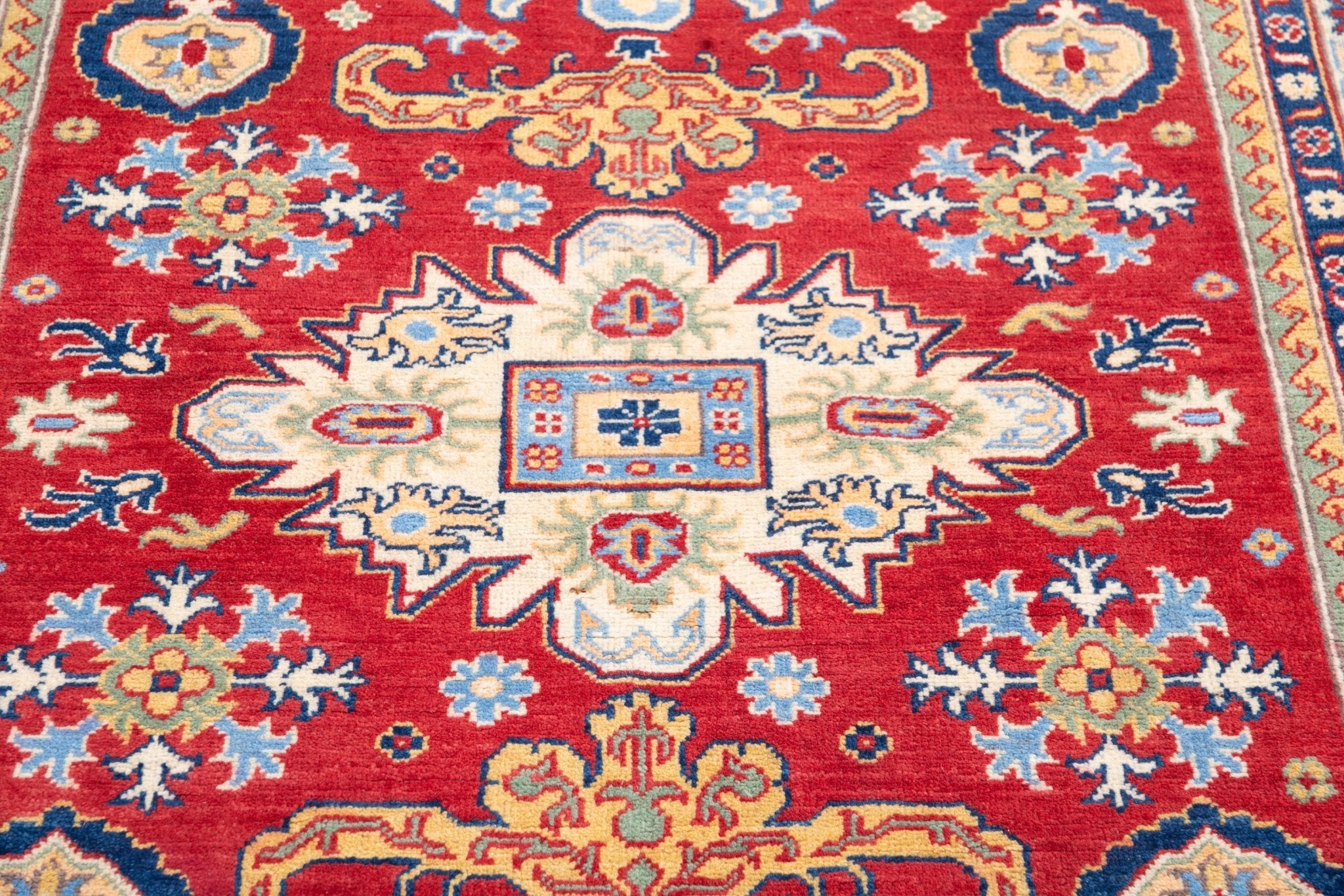 Pattern detail of red & ivory Kazak-inspired wool rug 21989.