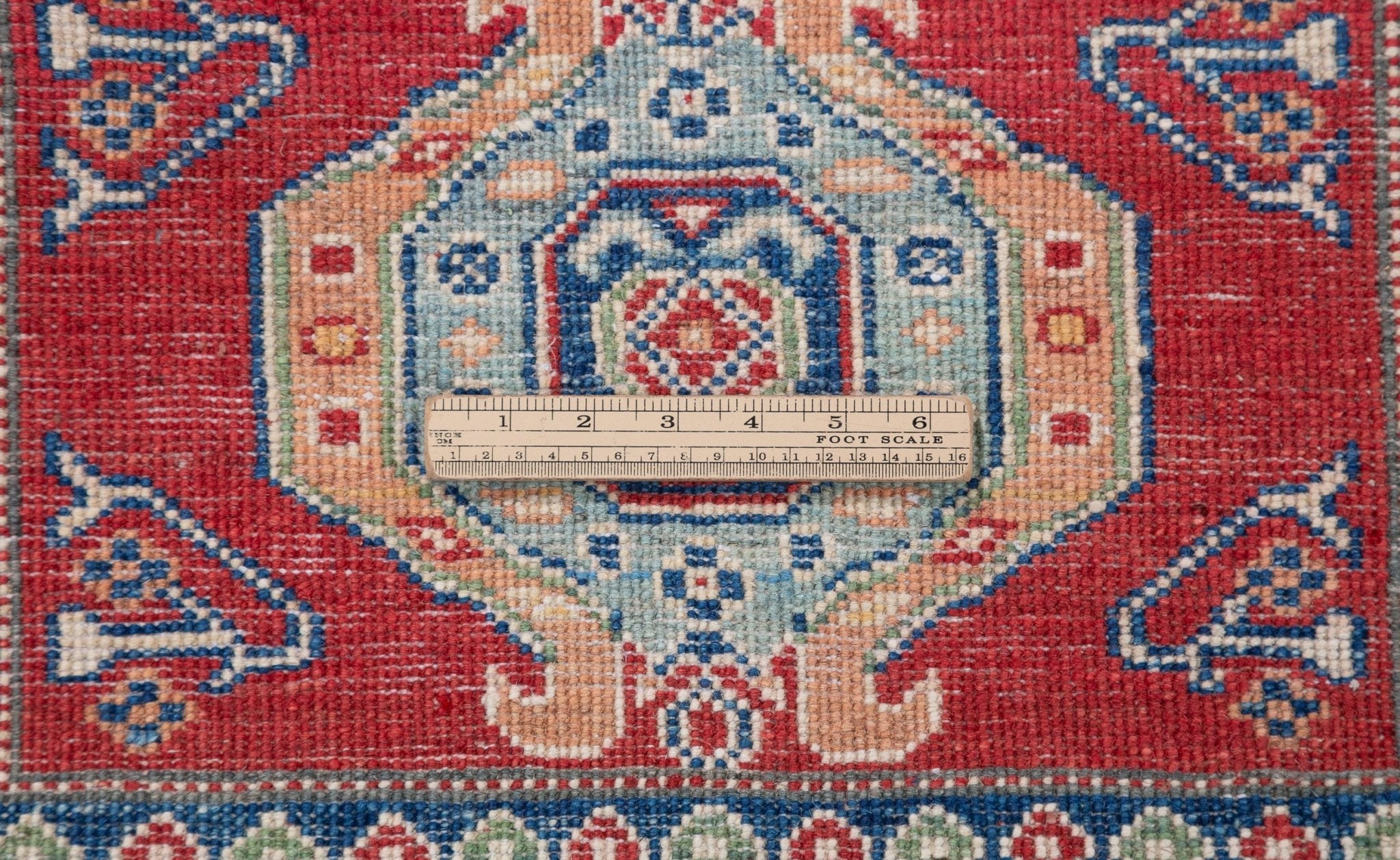 Wool pile close-up of red & blue Kazak-inspired wool runner 29654.