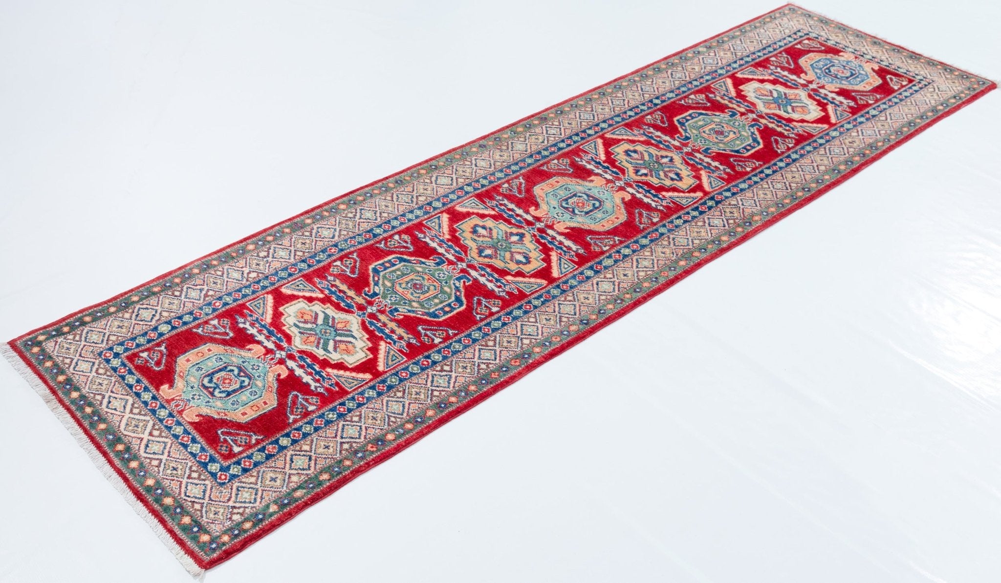 Full view at an angle of red & blue Kazak-inspired wool runner 29654.