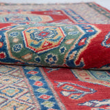 Folded edge and wool pile of red & blue Kazak-inspired wool runner 29654.