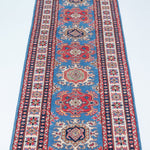 Full view from a low angle of blue & red Kazak-inspired wool runner 29653.