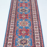 Full view from a low angle of blue & red Kazak-inspired wool runner 29653.
