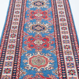 Border and edge detail of blue & red Kazak-inspired wool runner 29653.