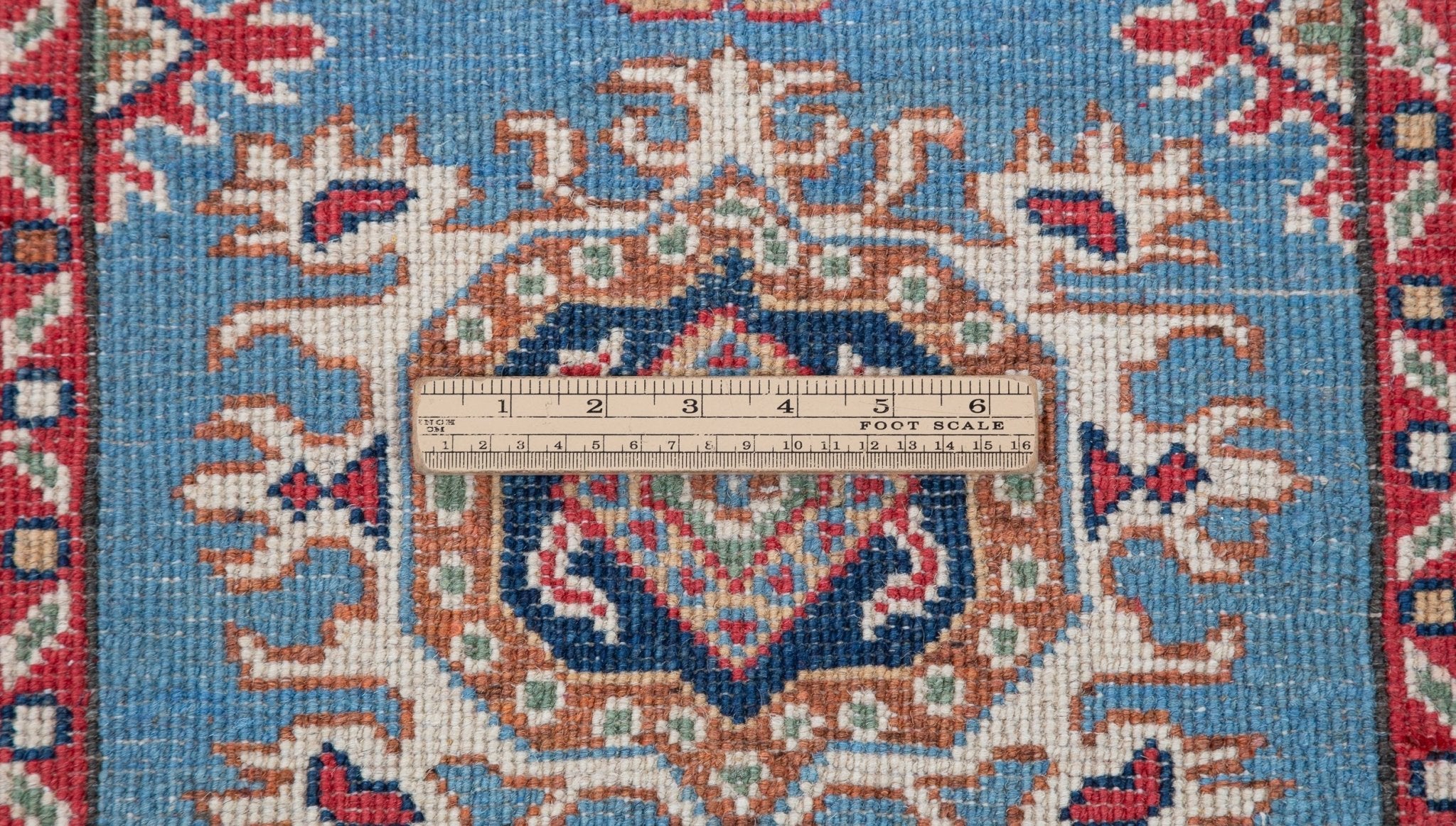 Wool pile close-up of blue & red Kazak-inspired wool runner 29653.