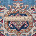 Wool pile close-up of blue & red Kazak-inspired wool runner 29653.