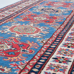 Pattern detail of blue & red Kazak-inspired wool runner 29653.