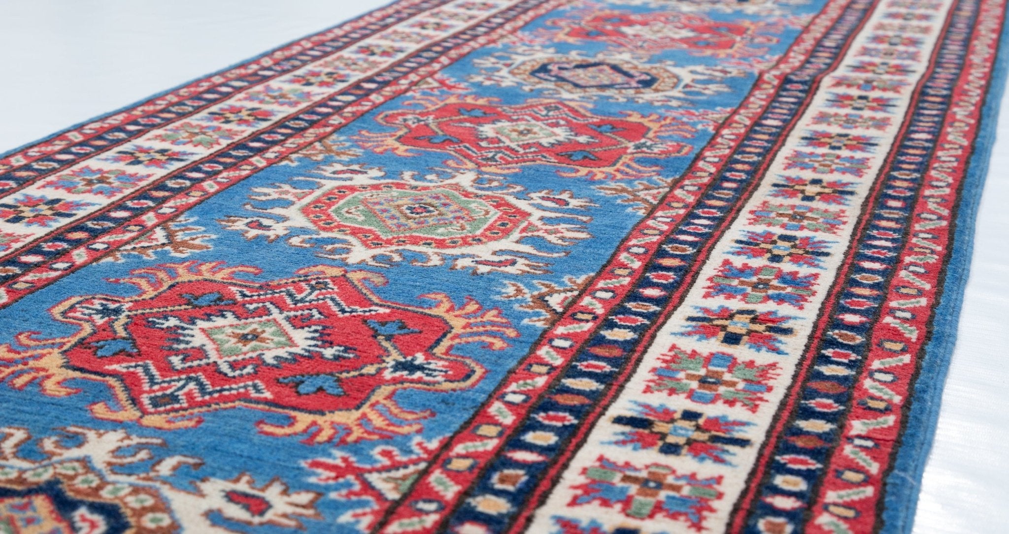 Pattern detail of blue & red Kazak-inspired wool runner 29653.
