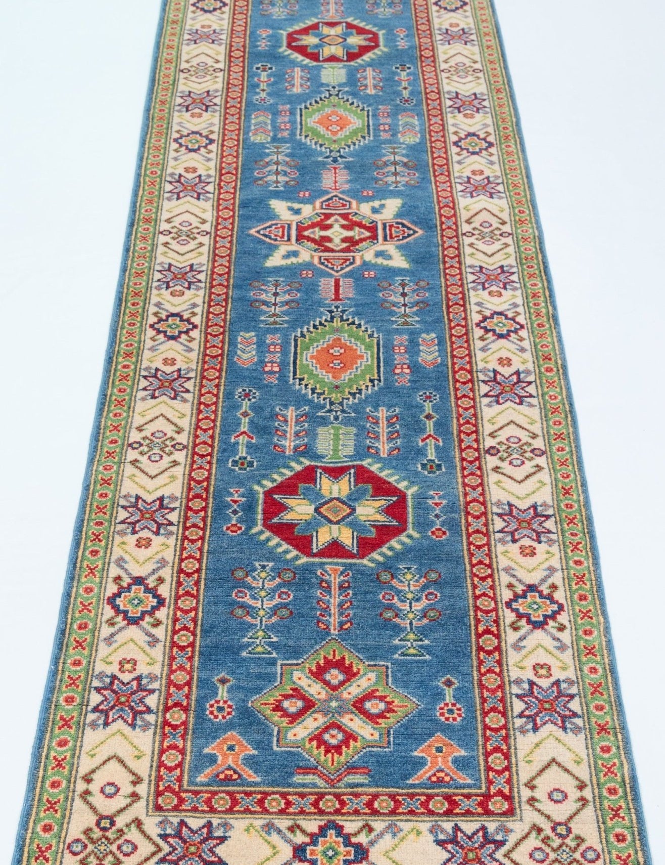 Full view from a low angle of blue & ivory Kazak-inspired wool runner 29655.