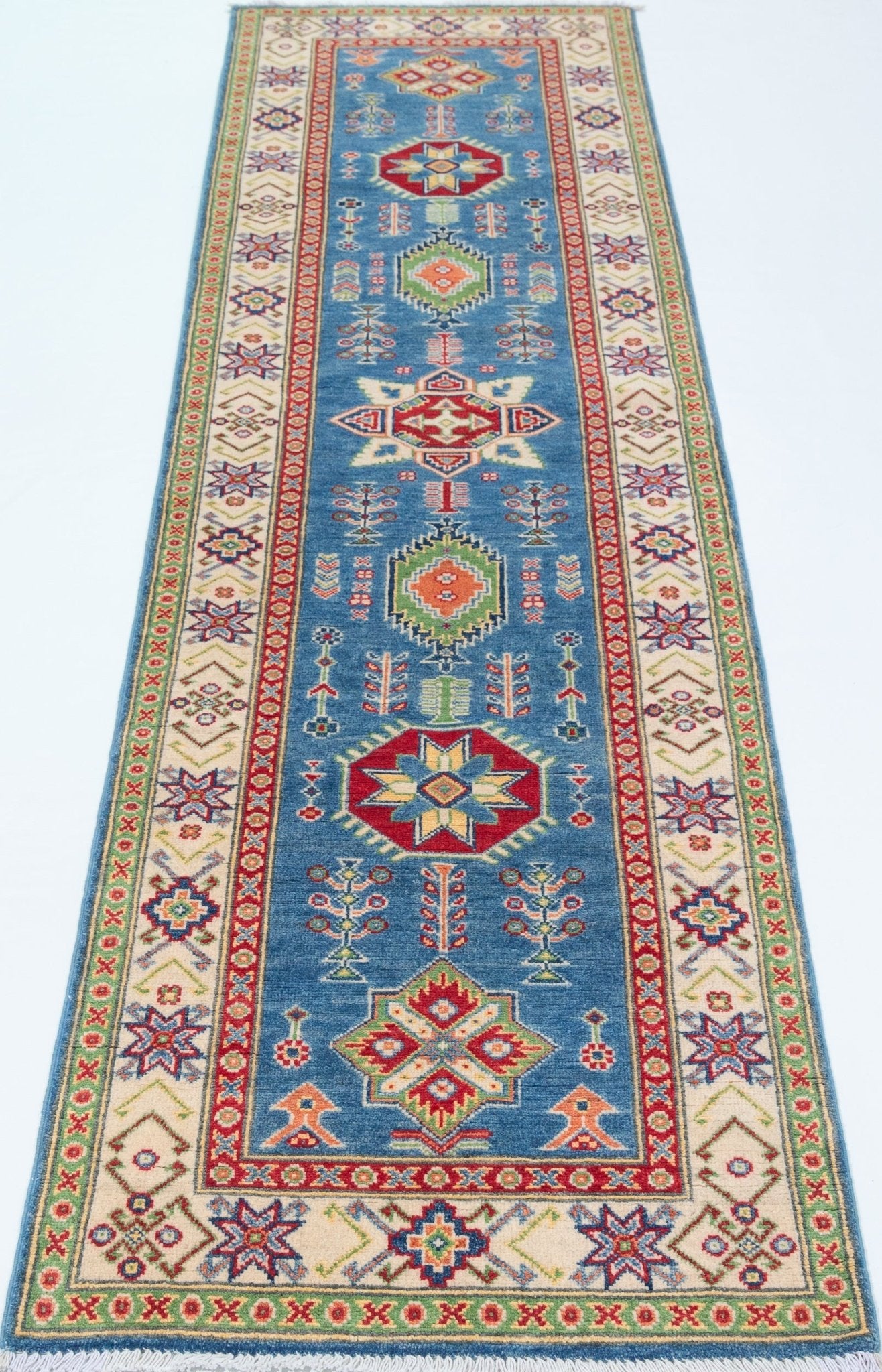 Full view from a low angle of blue & ivory Kazak-inspired wool runner 29655.