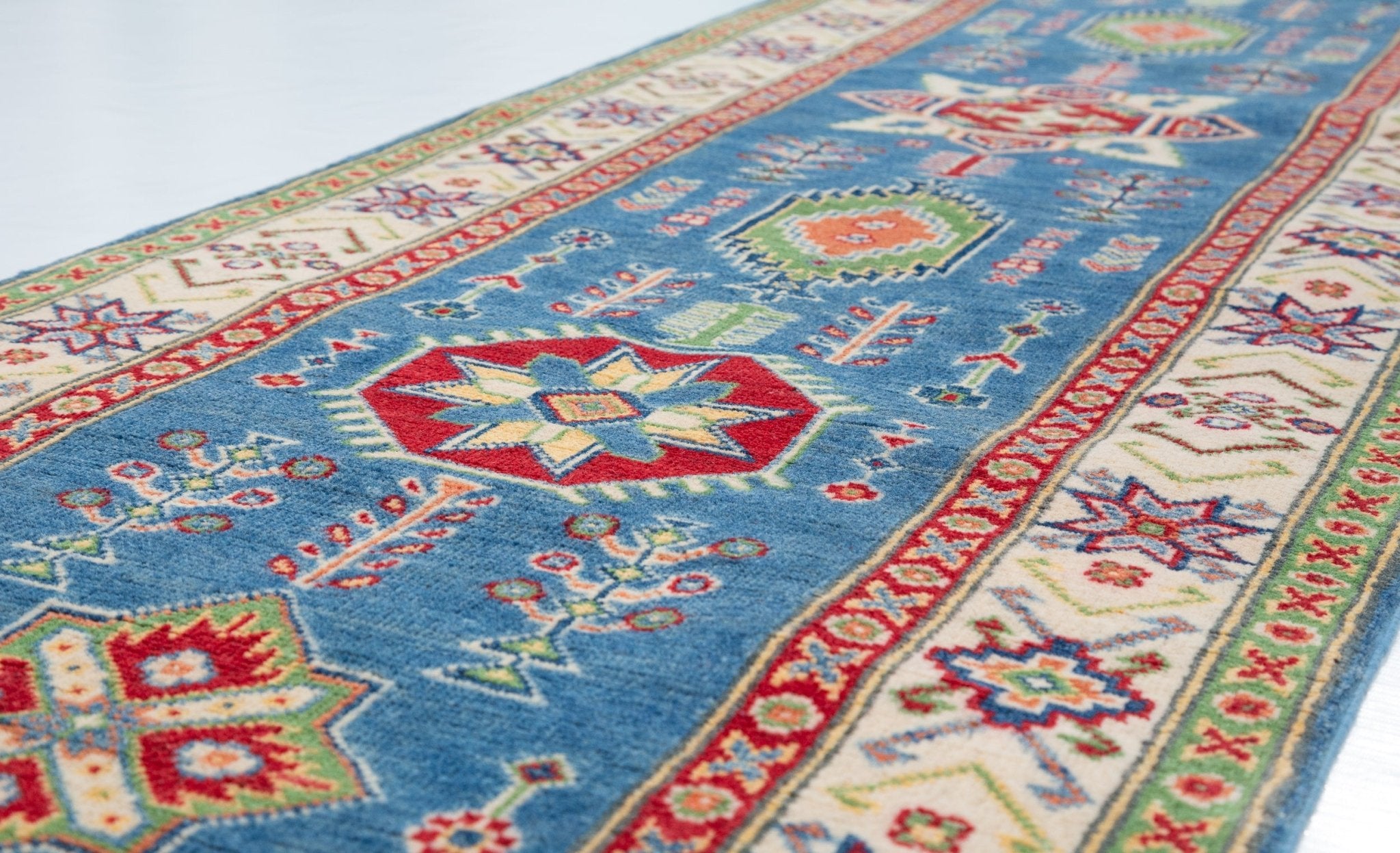 Pattern detail of blue & ivory Kazak-inspired wool runner 29655.