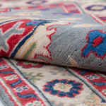 Folded edge and wool pile of blue & ivory Kazak-inspired wool runner 29657.