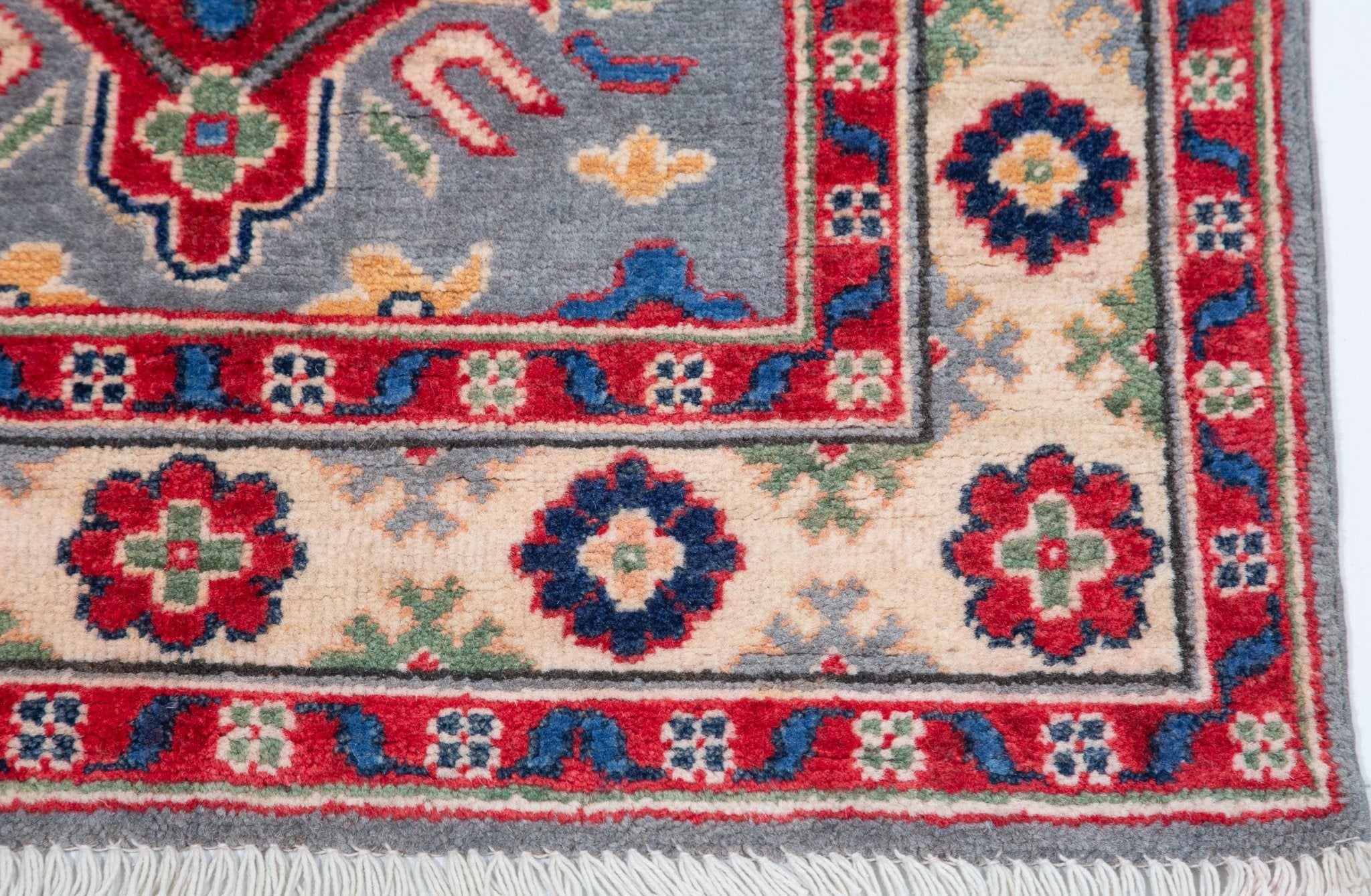 Border and edge detail of blue & ivory Kazak-inspired wool runner 29657.
