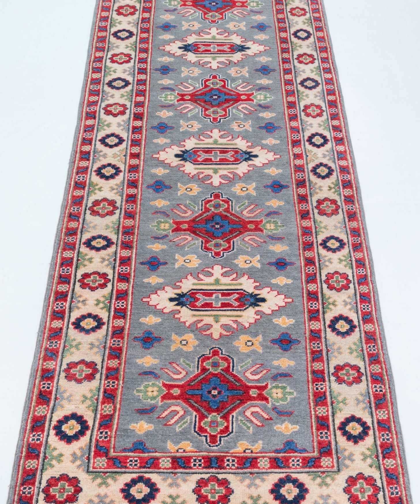 Full view from a low angle of blue & ivory Kazak-inspired wool runner 29657.