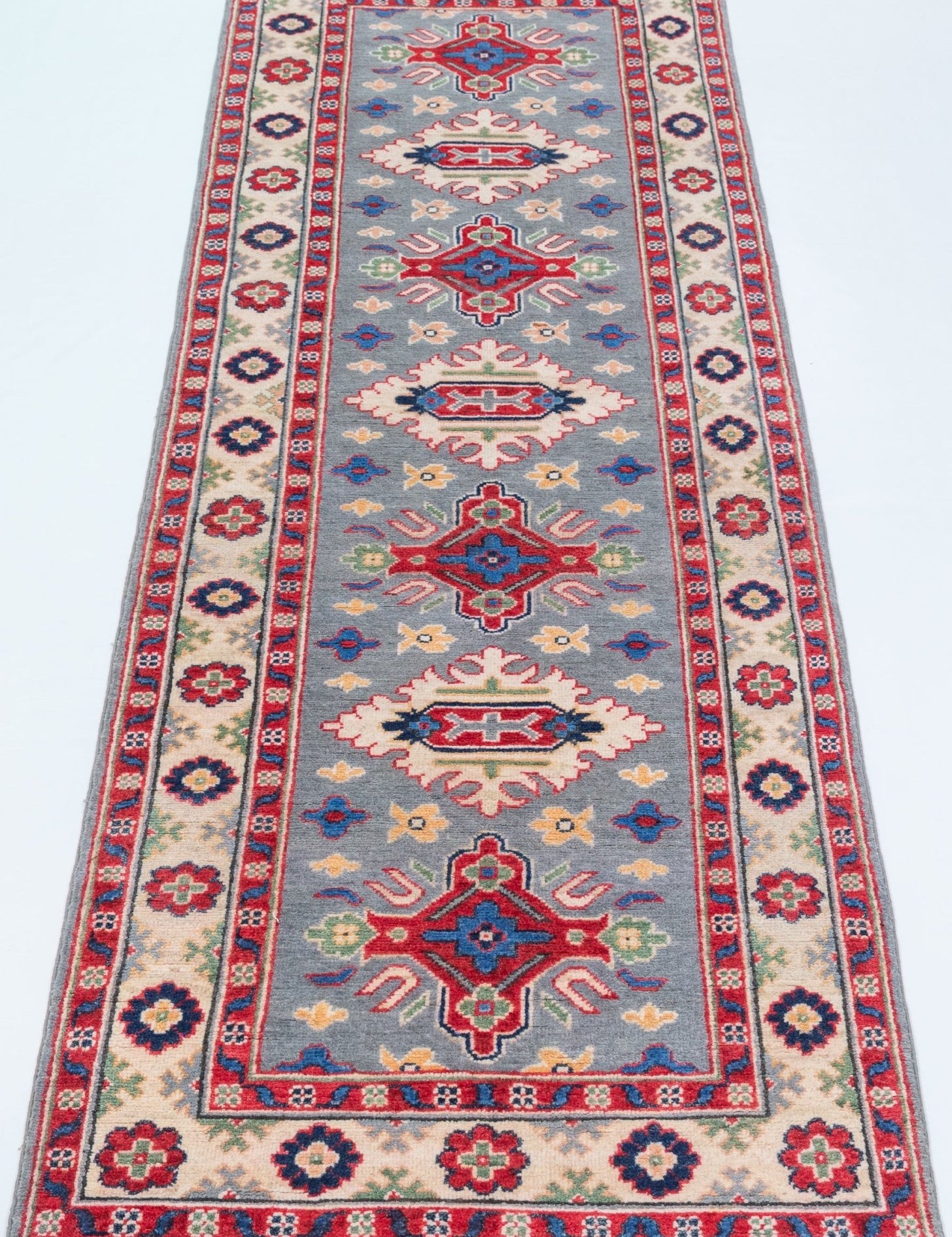Full view from a low angle of blue & ivory Kazak-inspired wool runner 29657.