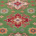 Pattern detail of green & red Kazak-inspired wool runner 29353.