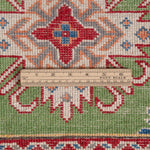 Wool pile close-up of green & red Kazak-inspired wool runner 29353.