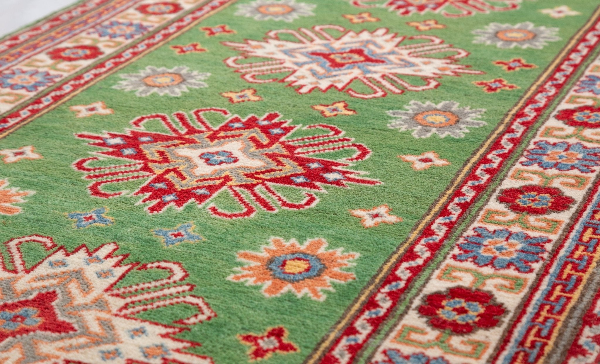 Pattern detail of green & red Kazak-inspired wool runner 29353.