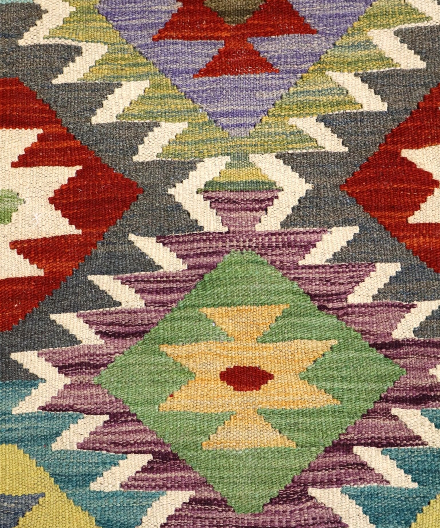Afghan Maimana kilim rug close-up, multicolor diamond and zigzag motifs