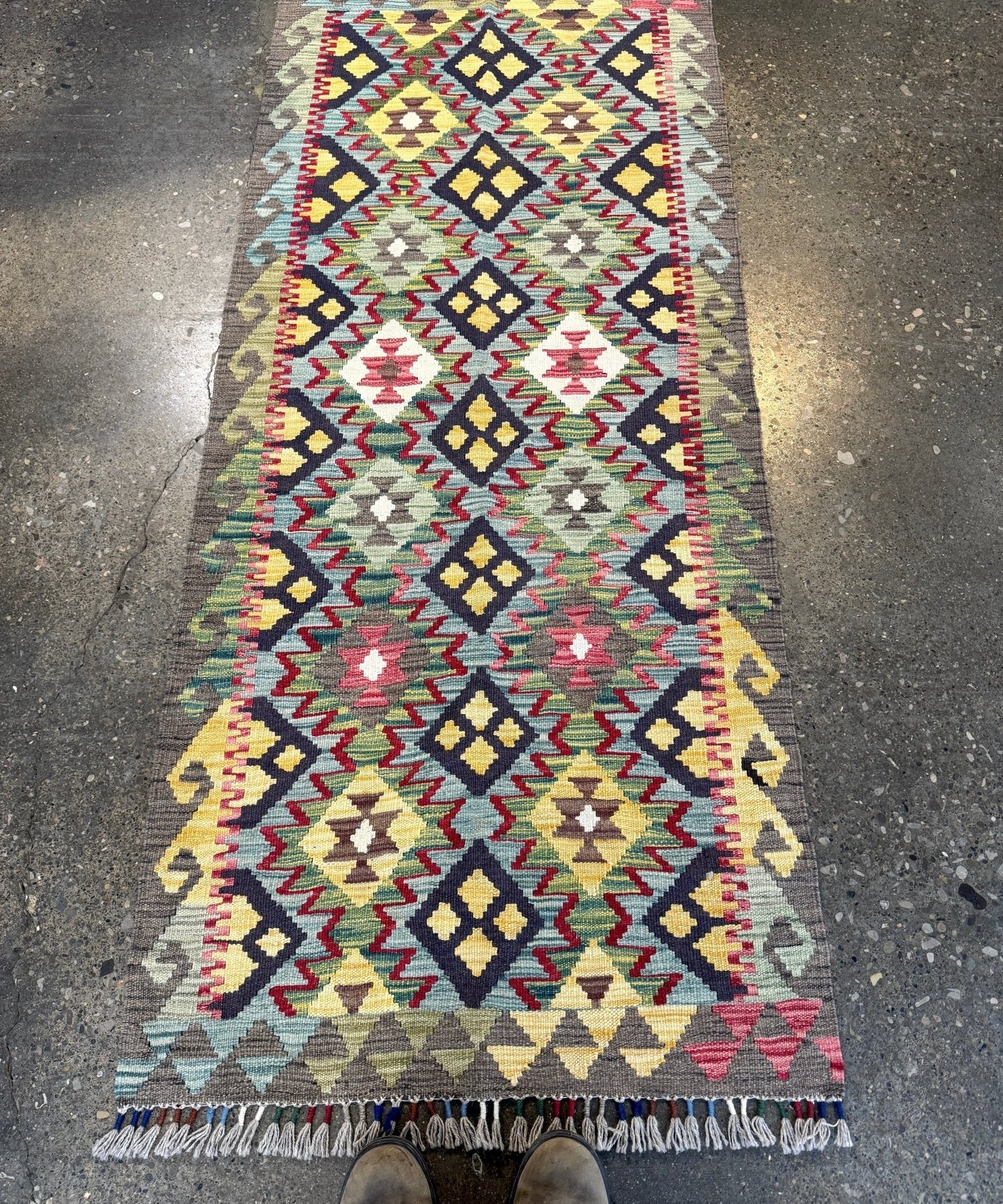 Kilim rug with multicolor geometric diamond pattern and fringe edges
