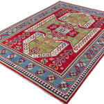 Full view at an angle of red & green Kazak-inspired wool rug 24948.