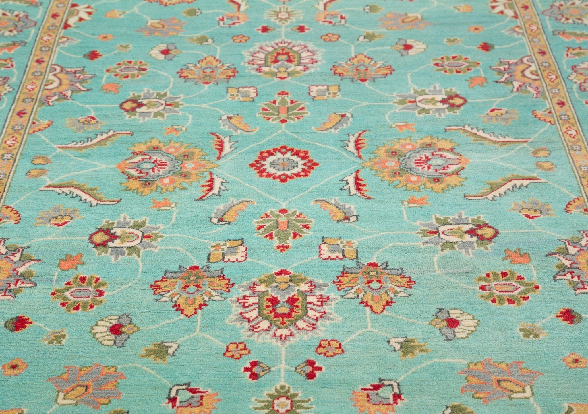 Pattern detail of turquoise & red Kazak-inspired wool rug 29664.