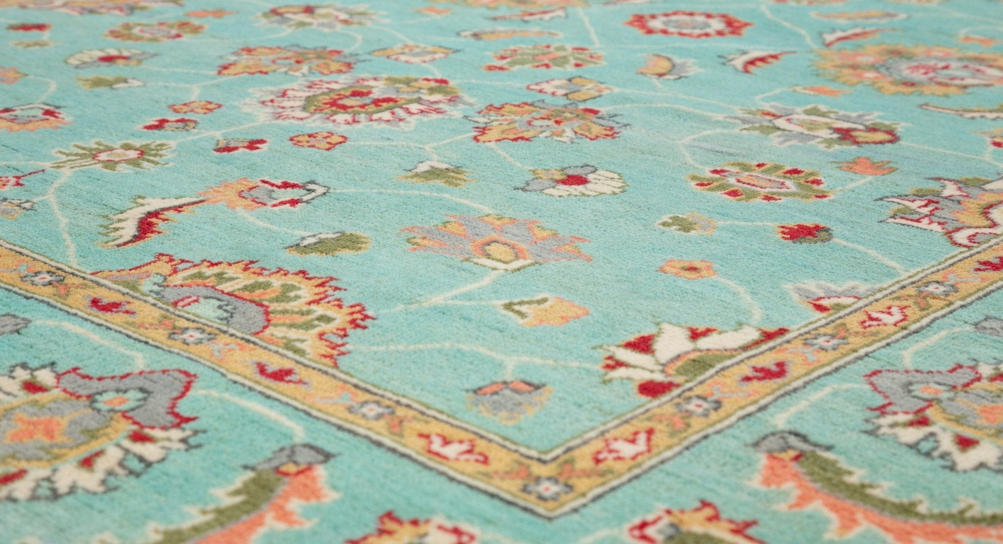 Pattern detail of turquoise & red Kazak-inspired wool rug 29664.