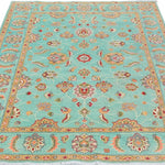Full view from a low angle of turquoise & red Kazak-inspired wool rug 29664.
