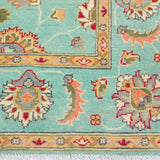 Border and edge detail of turquoise & red Kazak-inspired wool rug 29664.