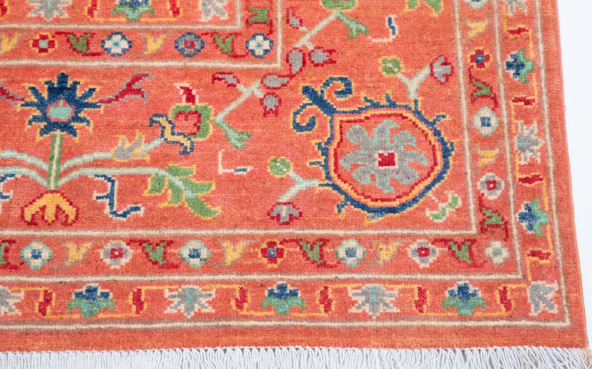 Border and edge detail of orange & blue Kazak-inspired wool rug 29636.